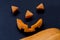 Cut parts of a smiling scary halloween pumpkin