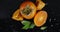 Cut persimmon with leaves rotates slowly. Top view.