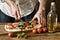 Cut the pizza with tomato, rocket and mozzarella - traditional Roman pizza - desaturation effect - selective focus