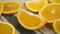 Cut Ripe Orange Fruit on White Tablecloth Rotates