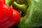 Cut shot of green,red bell pepper background with water drops