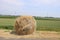 Cut sides of road like hay in a roll