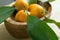 Cut into slices of fruit kumquat in a wooden plate