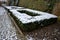 cut squares of flowerbed edging in a historic garden