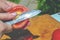 Cut the tomato into slices with a knife. Close-up. Cored a fresh red tomato for cooking