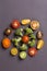 Cut vegetables - tomato, broccoli on grey background