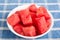 Cut Watermelon Chunks in White Bowl