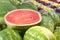 Cut Watermelon on Display in a pile at a farmers market