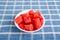 Cut Watermelon in White Bowl on Blue Towel