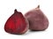 Cut and whole beets on white background