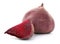 Cut and whole beets on white background
