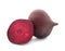 Cut and whole beets on white background