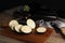 Cut and whole raw ripe eggplants on wooden table