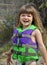 Cute 3 Year Old Girl Muddy in Life Vest