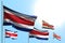 Cute 5 flags of Costa Rica are waving on blue sky background - any occasion flag 3d illustration