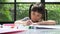 Cute adorable asian ethnic kid girl holding color pen draw and painting, She is Having Fun and Laughs. Concept of learn and enjoy