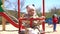 Cute adorable baby girl on swing in slowmo