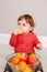 Cute adorable Caucasian baby boy eating citrus fruit. Finny child eating healthy organic snack for healthy immune system. Solid