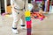 Cute adorable caucasian baby boy playing colorful toys at home. Happy child having fun building tower of soft rubber cubes.