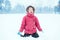 Cute adorable funny Caucasian excited girl child eating licking snow during cold winter snowy day. Kids outdoors seasonal activity