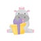 Cute adorable hippo with a pink bow sitting and holding gift box, lovely behemoth animal cartoon character vector