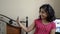 Cute adorable Indian Asian caucasian happy girl child taking selfie making pout on mobile phone and checking front view portrait