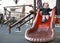 Cute adorable pretty caucasian blonde baby girl sliding,having fun.Happy, warm clothing child,kid,toddler, infant of 1-2