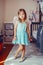 Cute adorable pretty dressed preschool girl playing a fairy princess at home. Child creativity imagination and fantasy dreams