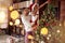 Cute African American girl decorating Christmas tree with father