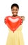 Cute african american woman holding red balloon heart valentines