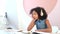 Cute African girl is studying online