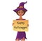 Cute afro-american witch holding a piece of paper with happy halloween text.