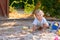 Cute alert little baby boy crawling in sand