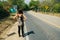 Cute American woman hitchhiking in latin america