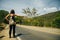 Cute American woman hitchhiking in latin america