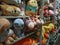 Cute animal dolls on orderly shelves in gift shop background