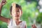 Cute asian child girl eating delicious instant noodles with fork