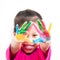 Cute asian child girl with hands painted in colorful paint