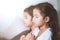 Cute asian child girl and her sister praying with folded hand