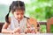 Cute asian child girl playing and creating with play dough