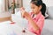 Cute asian child girl playing and creating with playdough and straws.