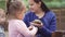 Cute asian child holding and playing with turtle. She is not scared to hold it on hand. Concept of self learning and