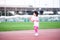 Cute Asian girl jogging exercise in the stadium. Active child sweet smile. Happy children good health, play sports.