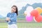 Cute asian girl smile and holding balloon.