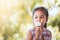 Cute asian little child girl is eating delicious icecream cone