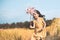 Cute asian little child girl playing with wind turbine