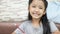 Cute Asian little girl smiling with happiness with copy space composition