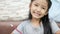 Cute Asian little girl smiling with happiness with copy space composition