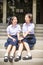 Cute Asian Thai high schoolgirls student couple in school