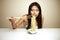 Cute Asian woman eating noodles